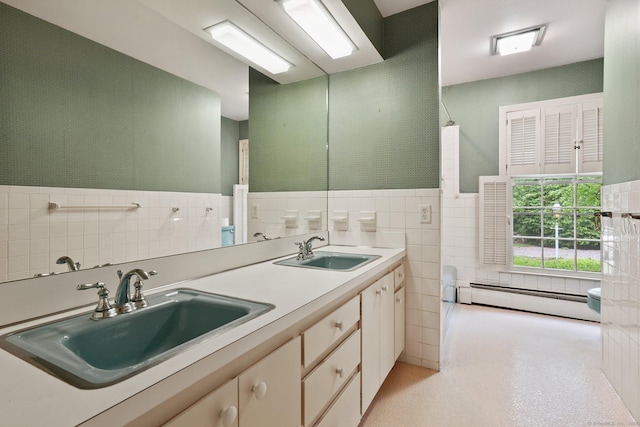345 Hollow Tree Ridge Rd, Darien, CT 06820 - bathroom with baseboard heating, tile walls, double vanity, and a wainscoted wall