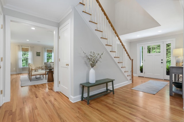 110 Florence Ln, Fairfield, CT 06824 - foyer entrance featuring crown molding, light wood finished floors, recessed lighting, stairway, and baseboards