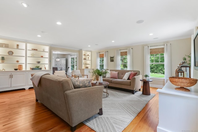 110 Florence Ln, Fairfield, CT 06824 - living area featuring ornamental molding, light wood-style flooring, recessed lighting, and built in features