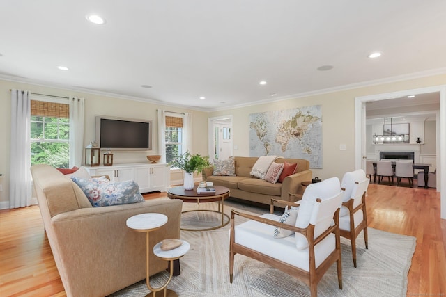 110 Florence Ln, Fairfield, CT 06824 - living area featuring crown molding, light wood finished floors, recessed lighting, and baseboards