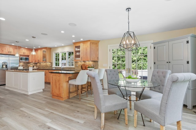 110 Florence Ln, Fairfield, CT 06824 - dining room featuring french doors, light wood-style floors, recessed lighting, and a chandelier