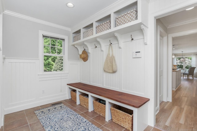 110 Florence Ln, Fairfield, CT 06824 - mudroom with a decorative wall, a wainscoted wall, ornamental molding, and tile patterned flooring