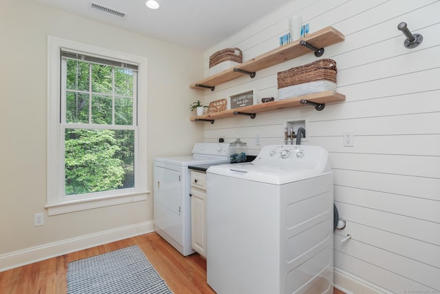 110 Florence Ln, Fairfield, CT 06824 - washroom with washer and clothes dryer, light wood-style floors, and baseboards