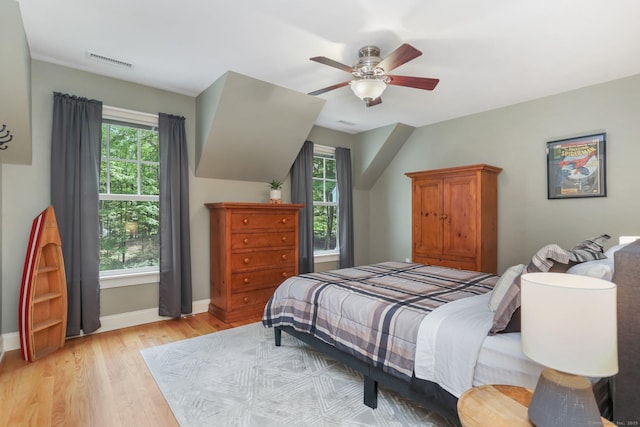 110 Florence Ln, Fairfield, CT 06824 - bedroom featuring light wood finished floors, baseboards, multiple windows, and a ceiling fan