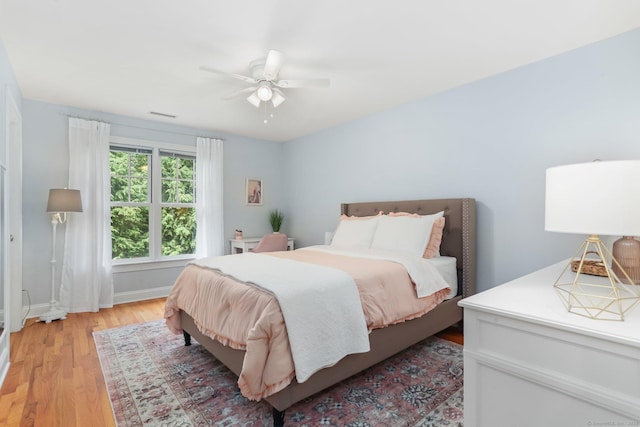 110 Florence Ln, Fairfield, CT 06824 - bedroom with light wood-style flooring, ceiling fan, and baseboards