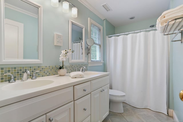 110 Florence Ln, Fairfield, CT 06824 - full bathroom with toilet, double vanity, tile patterned floors, decorative backsplash, and crown molding