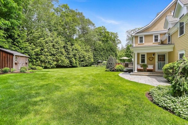 110 Florence Ln, Fairfield, CT 06824 - view of grassy yard with a deck