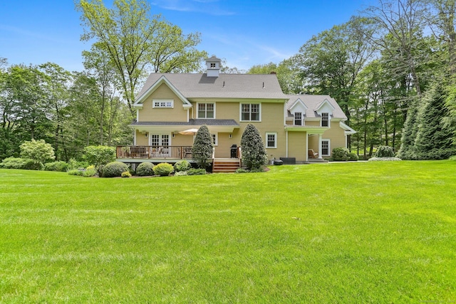 110 Florence Ln, Fairfield, CT 06824 - rear view of property with a wooden deck and a yard