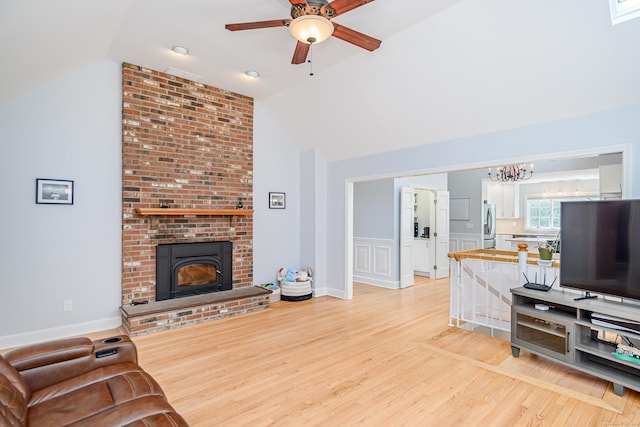 101 Railtree Hill Rd, Woodbury, CT 06798 - living area featuring lofted ceiling, light wood-type flooring, a ceiling fan, a chandelier, and a brick fireplace