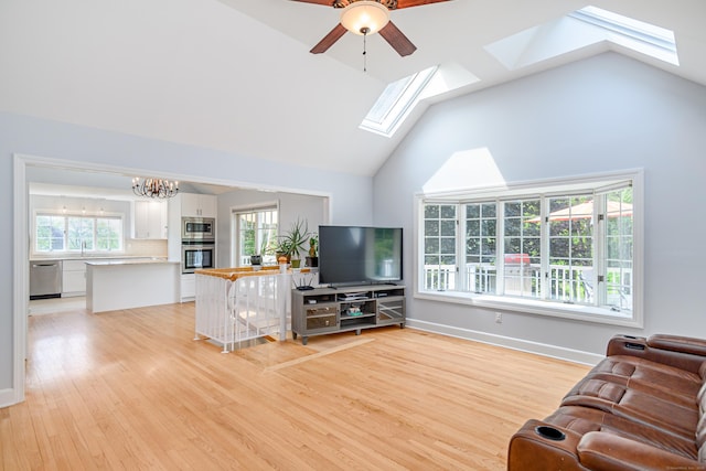 101 Railtree Hill Rd, Woodbury, CT 06798 - living room with a skylight, high vaulted ceiling, light wood-type flooring, a ceiling fan, and a chandelier