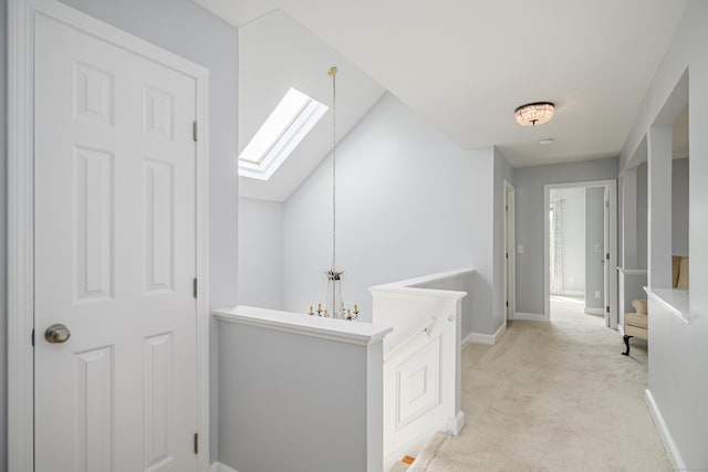 101 Railtree Hill Rd, Woodbury, CT 06798 - hall featuring a skylight, light colored carpet, an upstairs landing, and baseboards