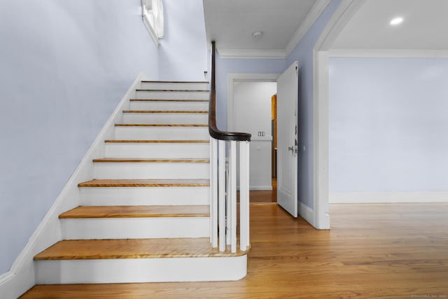 1897 Stanley St, New Britain, CT 06053 - stairs with wood finished floors, crown molding, arched walkways, and baseboards