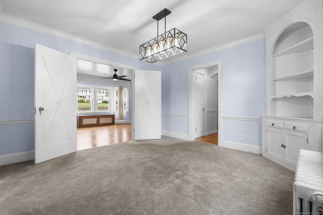 1897 Stanley St, New Britain, CT 06053 - unfurnished dining area featuring carpet, crown molding, ceiling fan, and baseboards