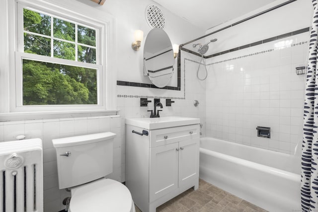 1897 Stanley St, New Britain, CT 06053 - full bath with radiator, shower / tub combo with curtain, vanity, toilet, and tile walls