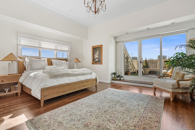 123 Harbor Dr Apt 403, Stamford, CT 06902 - bedroom with access to exterior, a chandelier, wood finished floors, baseboards, and crown molding