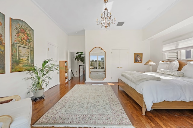 123 Harbor Dr Apt 403, Stamford, CT 06902 - bedroom with ornamental molding, a chandelier, and dark wood-type flooring