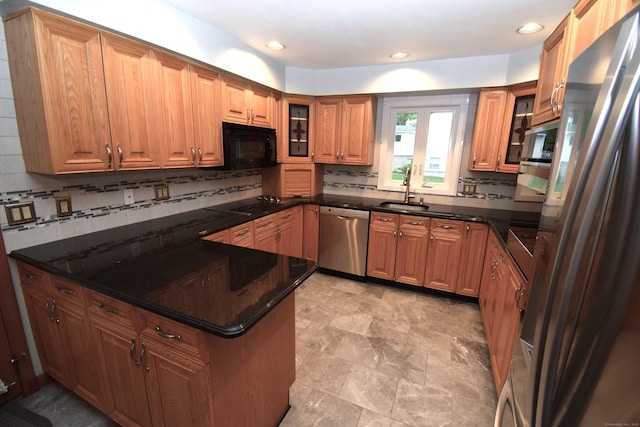 15 Valley Brook Rd, Branford, CT 06405 - kitchen with black appliances, backsplash, glass insert cabinets, brown cabinetry, and recessed lighting