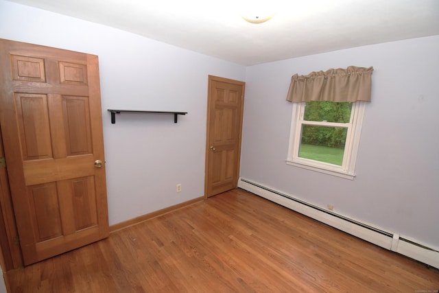 15 Valley Brook Rd, Branford, CT 06405 - unfurnished room with a baseboard heating unit, light wood-style floors, and baseboards