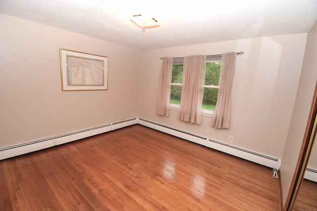 15 Valley Brook Rd, Branford, CT 06405 - spare room featuring wood finished floors and baseboard heating