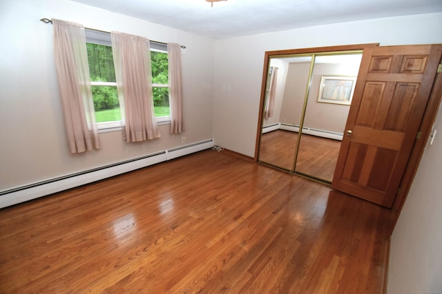 15 Valley Brook Rd, Branford, CT 06405 - unfurnished bedroom with wood finished floors, a baseboard radiator, and a closet