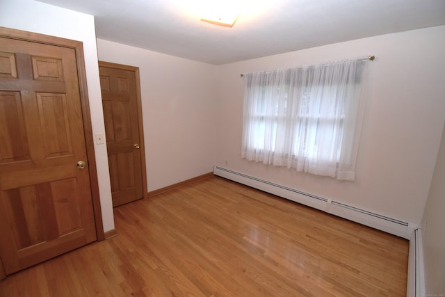 15 Valley Brook Rd, Branford, CT 06405 - empty room featuring baseboard heating, light wood-type flooring, and baseboards