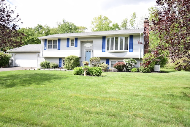 15 Valley Brook Rd, Branford, CT 06405 - raised ranch with a chimney, a front yard, concrete driveway, and a garage