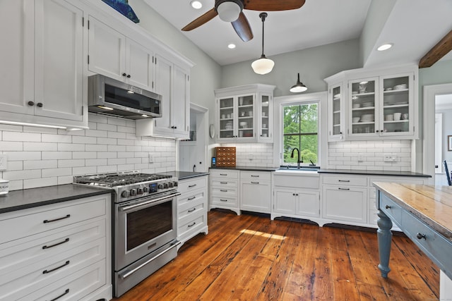 131 Elm St, Guilford, CT 06437 - kitchen featuring stainless steel appliances, a sink, dark countertops, a ceiling fan, and recessed lighting