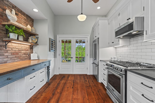 131 Elm St, Guilford, CT 06437 - kitchen featuring high quality appliances, white cabinetry, dark wood-type flooring, decorative backsplash, and open shelves