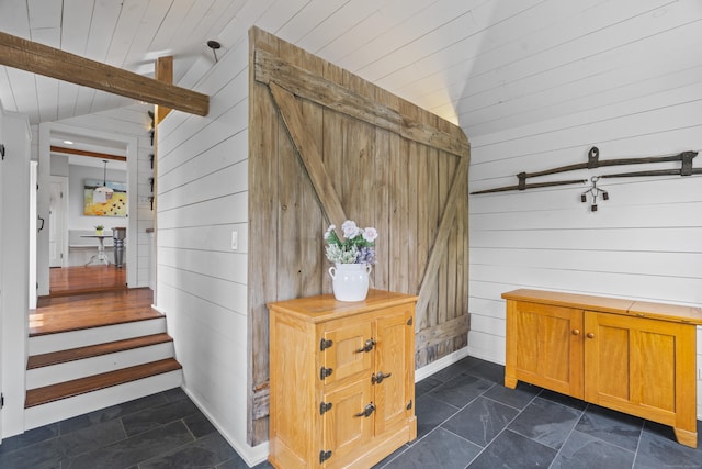 131 Elm St, Guilford, CT 06437 - mudroom featuring wooden walls, wood ceiling, and baseboards