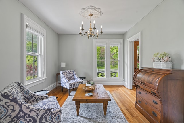 131 Elm St, Guilford, CT 06437 - living area with a chandelier and light wood-type flooring