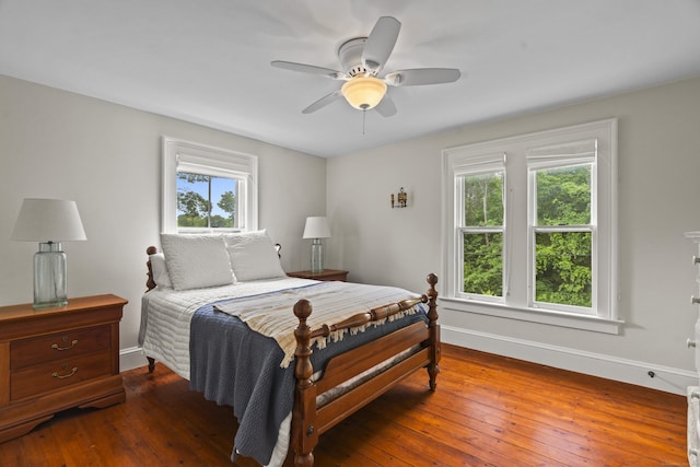 131 Elm St, Guilford, CT 06437 - bedroom with multiple windows, baseboards, hardwood / wood-style floors, and a ceiling fan