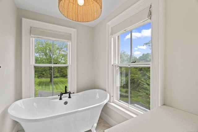 131 Elm St, Guilford, CT 06437 - full bath featuring a freestanding tub and baseboards