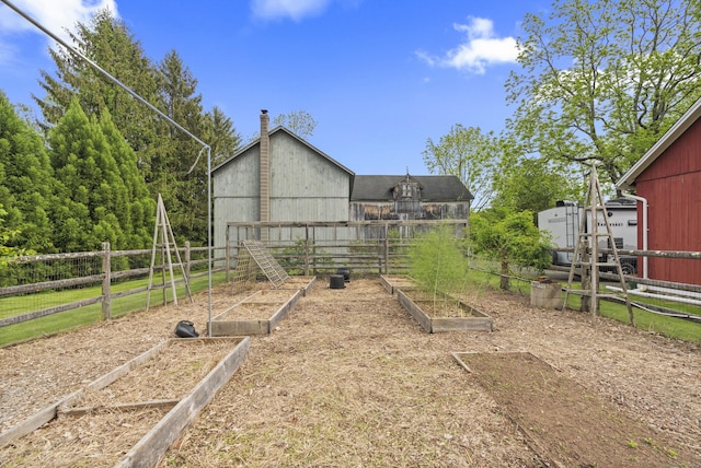 131 Elm St, Guilford, CT 06437 - view of yard featuring a garden and an outdoor structure