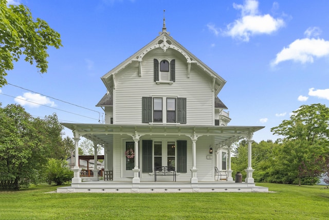 131 Elm St, Guilford, CT 06437 - rear view of property with a porch and a yard