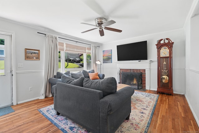 9 Waterhorse Brook Dr, Bethel, CT 06801 - living room with ceiling fan, ornamental molding, a fireplace, wood finished floors, and baseboards