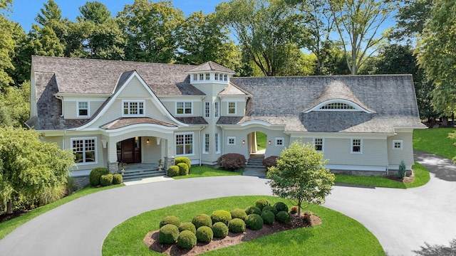 80 Compo Rd N, Westport, CT 06880 - shingle-style home with curved driveway, a front yard, and covered porch