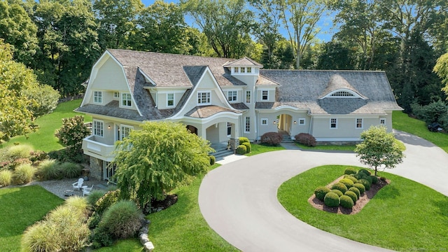 80 Compo Rd N, Westport, CT 06880 - shingle-style home with curved driveway, a front lawn, view of scattered trees, and a gambrel roof