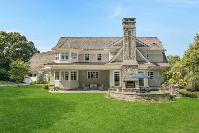 80 Compo Rd N, Westport, CT 06880 - rear view of property featuring a lawn, a patio area, a chimney, and a garage
