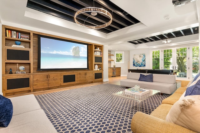80 Compo Rd N, Westport, CT 06880 - cinema room with built in shelves, healthy amount of natural light, wood finished floors, and a tray ceiling