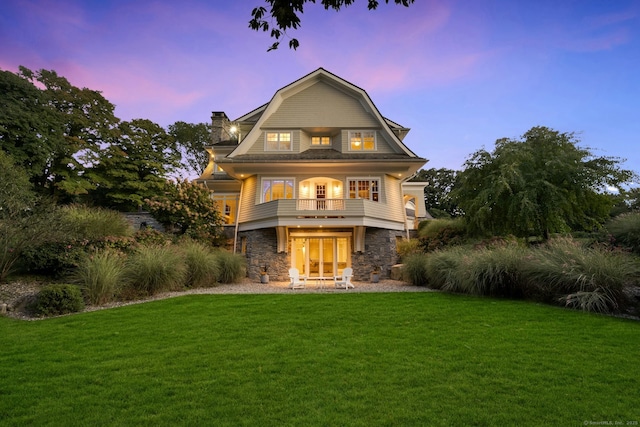 80 Compo Rd N, Westport, CT 06880 - view of front of property featuring stone siding, a balcony, a lawn, and a gambrel roof