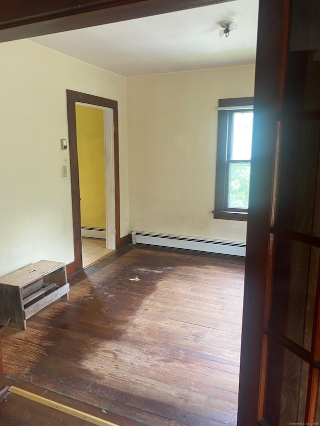 235 Long Hill Ave, Shelton, CT 06484 - empty room featuring a baseboard heating unit, hardwood / wood-style floors, and baseboards