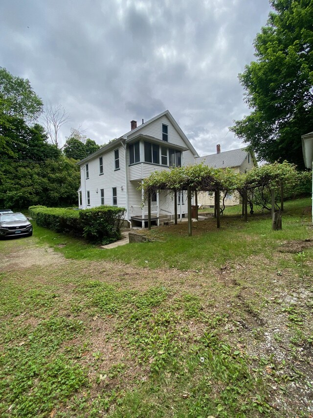 235 Long Hill Ave, Shelton, CT 06484 - back of house with a chimney