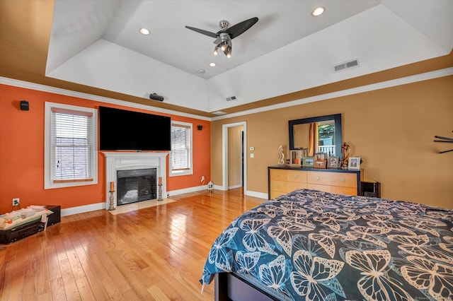70 Birchwood Dr, Middletown, CT 06457 - bedroom featuring light wood finished floors, multiple windows, a fireplace with flush hearth, ornamental molding, and recessed lighting