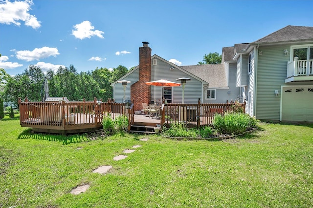 70 Birchwood Dr, Middletown, CT 06457 - rear view of house with roof with shingles, a wooden deck, and a lawn