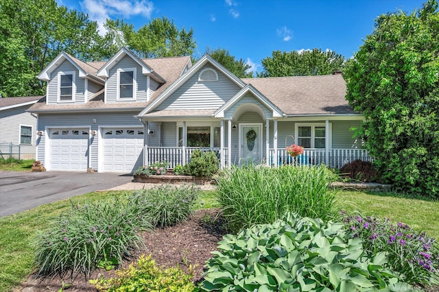 70 Birchwood Dr, Middletown, CT 06457 - view of front of home with a porch, driveway, and a shingled roof