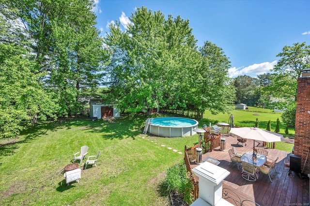 70 Birchwood Dr, Middletown, CT 06457 - view of grassy yard with a deck, outdoor dining space, and an outdoor pool