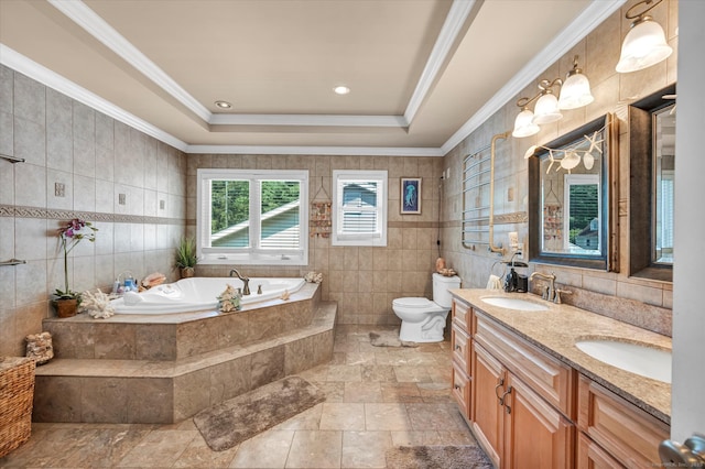 70 Birchwood Dr, Middletown, CT 06457 - full bathroom featuring tile walls, a garden tub, double vanity, toilet, and stone finish flooring