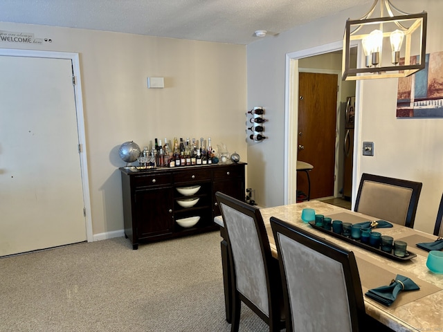 309 High Path Rd Unit 309, Windsor, CT 06095 - dining area featuring a chandelier, light colored carpet, and a textured ceiling