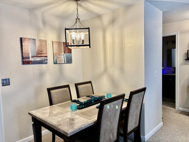 309 High Path Rd Unit 309, Windsor, CT 06095 - dining room featuring carpet, baseboards, and a chandelier