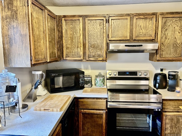 309 High Path Rd Unit 309, Windsor, CT 06095 - kitchen with stainless steel electric range, extractor fan, black microwave, and light countertops